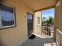 Condo #416 has a shaded balcony with views of lush Florida landscaping at 3647 Lake Bayshore Dr # 416, Bradenton, FL 34205