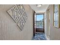 Entryway features decorative wall art, nice tile, and a screen door at 3647 Lake Bayshore Dr # 416, Bradenton, FL 34205