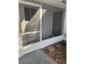 Cozy screened front patio offering bug-free outdoor relaxation at 3921 Lakeside Rd # 168, Sarasota, FL 34232
