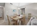 Dining room has seating for four with natural light and neutral paint at 5291 Willow Links # 54, Sarasota, FL 34235