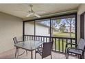 A screened patio has a ceiling fan and offers scenic views of the surrounding landscape at 5291 Willow Links # 54, Sarasota, FL 34235