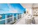 Relaxing balcony with comfortable seating and spectacular waterfront views at 555 Quay Cmn # 1601, Sarasota, FL 34236
