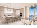 Modern kitchen with marble counters, island with seating, and high-end appliances at 555 Quay Cmn # 1601, Sarasota, FL 34236