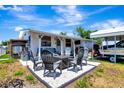 Large back patio featuring ample seating space, perfect for outdoor dining and relaxation at 997 28Th Avenue E Dr, Bradenton, FL 34208