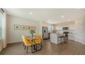 Eat-in kitchen features stainless appliances, white cabinets and a large island with bar stool seating at 13124 Bayberry Way, Parrish, FL 34219