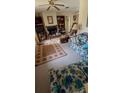 Cozy living room with a fireplace and comfortable furniture at 13406 Leatherbury Ave, Port Charlotte, FL 33953