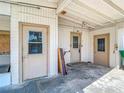 Spacious carport featuring multiple doors and ample room for parking and storage at 21966 Belinda Ave, Port Charlotte, FL 33952