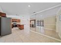 Open-concept kitchen featuring granite countertops, stainless steel appliances, island and tile floors at 2226 Fairfield Ave, Sarasota, FL 34232