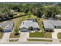 Charming single Gathering home with a spacious lawn, driveway, and fenced-in backyard pool at 245 Woodingham Trl, Venice, FL 34292