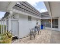 Cozy outdoor patio featuring a quaint seating area and charming decor at 3941 Glen Oaks E Dr # 32, Sarasota, FL 34232