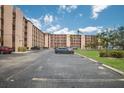 Condo complex with assigned parking spots and green space at 4015 Lake Bayshore Dr # 108, Bradenton, FL 34205