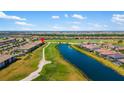 Stunning aerial view of the homes overlooking the golf course and pond at 5685 Palmer Cir # 204, Lakewood Ranch, FL 34211