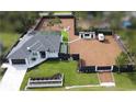 Expansive property features a modern home, fenced yard, ample space for boat and RV parking and outdoor living at 6875 Beckwith Ave, North Port, FL 34291