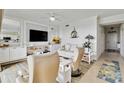 Comfortable living room with stylish decor and an entertainment center at 7019 River Hammock Dr # 306, Bradenton, FL 34212