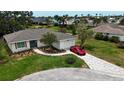 Charming single-story home featuring a well-manicured lawn, modern driveway, and attached garage at 8808 44Th Avenue W Dr, Bradenton, FL 34210