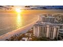 Beautiful beachfront condo building with picturesque views of the Gulf, beach access, and coastal cityscape at 1212 Benjamin Franklin Dr # 909, Sarasota, FL 34236