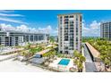 Beachfront condo building offers a pool, manicured landscaping, and beach access with breathtaking ocean views at 1212 Benjamin Franklin Dr # 909, Sarasota, FL 34236