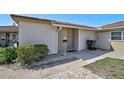 Inviting front entrance showcasing a neatly landscaped yard and a well-maintained exterior at 151 Vista Hermosa Cir # 31C, Sarasota, FL 34242
