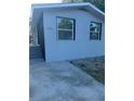 Exterior of renovated home featuring a freshly painted exterior, new windows and updated landscaping at 15233 Omaha St, Hudson, FL 34667