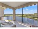 Enjoy panoramic water and golf course views from this expansive private balcony at 18114 Gawthrop Dr # 402, Bradenton, FL 34211