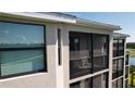Exterior view showcasing a screened-in lanai offering a private outdoor retreat at 18114 Gawthrop Dr # 402, Bradenton, FL 34211