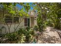 Exterior of property with garden views, brickwork, and lush landscaping at 2207 Hickory Ave, Sarasota, FL 34234