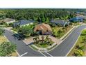 Aerial view of a house on a corner lot with professional landscaping and mature trees and greenery at 5439 74Th E Pl, Ellenton, FL 34222