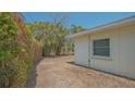 View of the side yard of this home showing room for landscaping or other improvements at 5522 Calle Del Verano, Sarasota, FL 34242