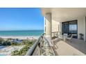 Relaxing balcony with seating and stunning ocean views, perfect for enjoying the coastal breeze at 1241 Gulf Of Mexico Dr # 803, Longboat Key, FL 34228