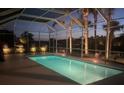 Well-lit screened pool with shimmering water, offering a peaceful and private outdoor space for relaxation and entertainment at 13167 Fernando St, Venice, FL 34293