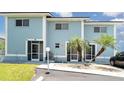 Charming condo with a private entrance and tropical landscaping, including palm trees at 1424 Mediterranean Dr # 112, Punta Gorda, FL 33950