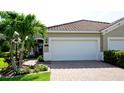This lovely home has an attached garage with a paved driveway and well-maintained landscaping at 1503 Calle Grand St, Bradenton, FL 34209