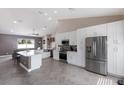 Modern kitchen with stainless steel appliances, sleek cabinetry, and seamless flow into the living area at 1606 22Nd W Ave, Palmetto, FL 34221