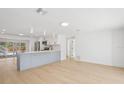Bright and airy kitchen space with an island, stainless appliances, and an open floor plan at 2655 Bay St, Sarasota, FL 34237
