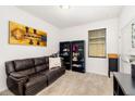 Cozy bedroom with a comfortable sofa and ample storage space with black bookshelves at 4119 Mossy Limb Ct, Palmetto, FL 34221