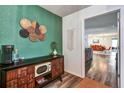 Stylish entryway showcasing a decorative cabinet and a glimpse into the open living space at 4542 19Th S Ave, St Petersburg, FL 33711