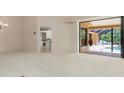 Open living space with sliding doors to lanai and clear view to the next room at 4625 Deer Creek Blvd, Sarasota, FL 34238