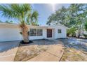 Welcoming single-story home featuring an oversized front window and a charming walkway to the front door at 4907 4Th Avenue Nw Cir, Bradenton, FL 34209