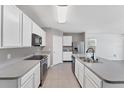 Bright kitchen with stainless steel appliances and ample counter space at 5717 71St E St, Palmetto, FL 34221