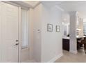 Bright foyer with white walls, trim and ceramic floors at 8073 Tybee Ct, University Park, FL 34201