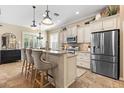 Charming eat-in kitchen with granite countertops, stainless steel appliances and pendant lighting at 11508 Griffith Park Ter, Bradenton, FL 34211