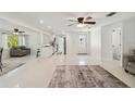 Bright living room showcasing open floor plan, neutral decor, and lots of natural light at 21152 Higgs Dr, Port Charlotte, FL 33952
