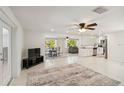 Open concept living space featuring a modern kitchen, dining area, and comfortable seating at 21152 Higgs Dr, Port Charlotte, FL 33952