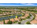Aerial view of home with water view in a community with lush landscaping at 212 River Enclave Ct, Bradenton, FL 34212