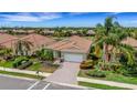 Desirable home in a neighborhood with lush landscaping and tile roofs at 212 River Enclave Ct, Bradenton, FL 34212