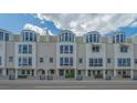 Street view of multi-level condo building, showcasing the well-maintained facade at 235 Cocoanut Ave # 108B, Sarasota, FL 34236
