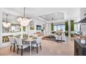 Bright and airy living room with a dining area, and lots of natural light at 3607 Santa Caterina Blvd, Bradenton, FL 34211