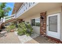 Close up of condo exterior featuring well-maintained landscaping and clearly marked unit numbers at 3705 S School Ave # 3, Sarasota, FL 34239