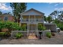 Charming two-story home with a white picket fence and well-maintained landscaping, plus a covered parking area at 508 Howard Ct, Sarasota, FL 34236