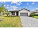 Charming single-Gathering home with manicured lawn and paved driveway at 5117 Marina Basin Ct, Bradenton, FL 34211
